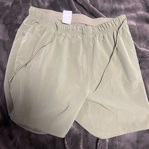 Green Nike shorts and red and black running Nike shorts